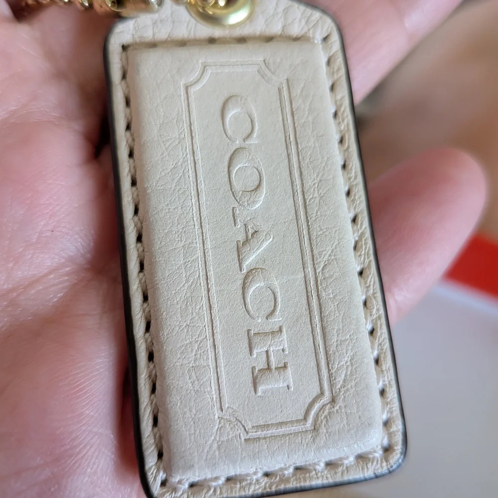 Coach White Pebbled‎ Leather Hang Tag in Cream with Gold Chain